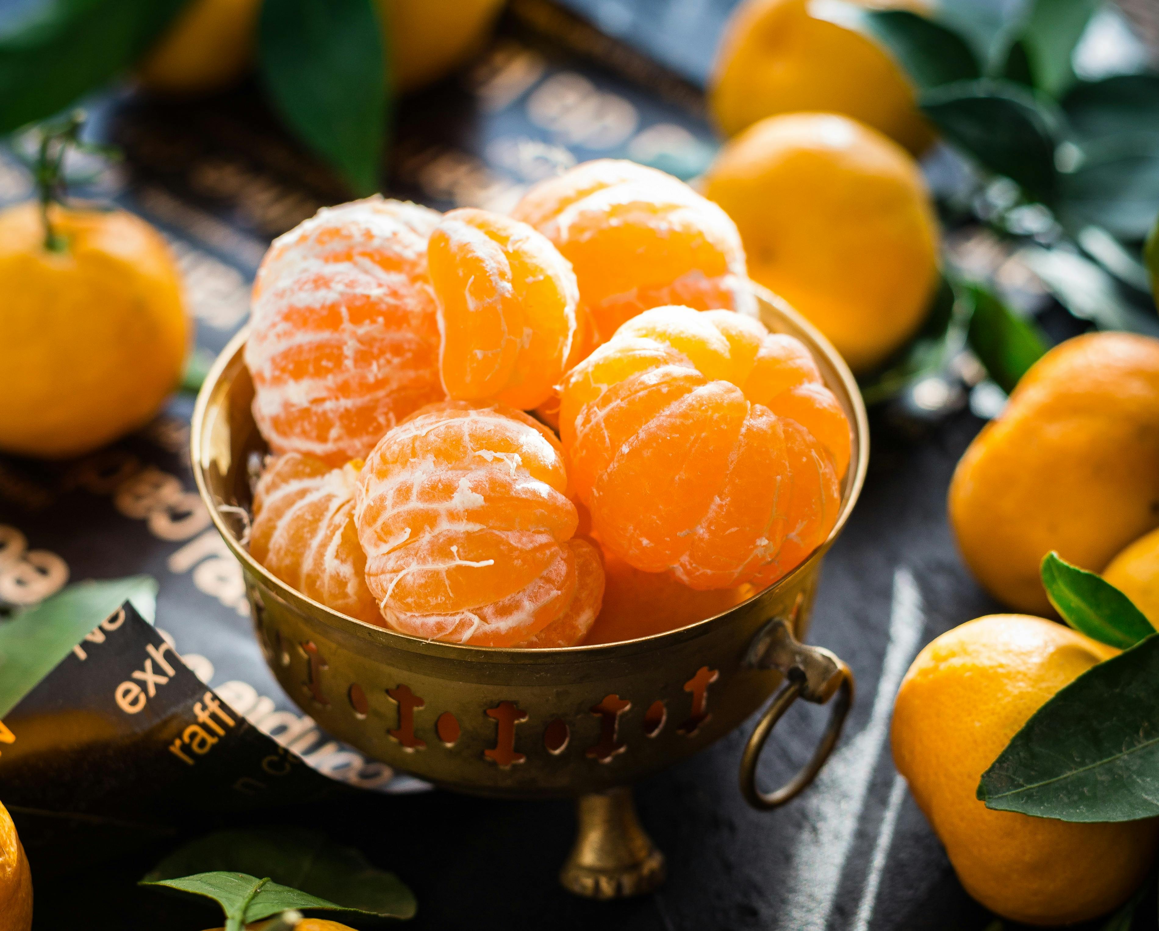 Peeled Tangerines in Brass Bowl — Food
