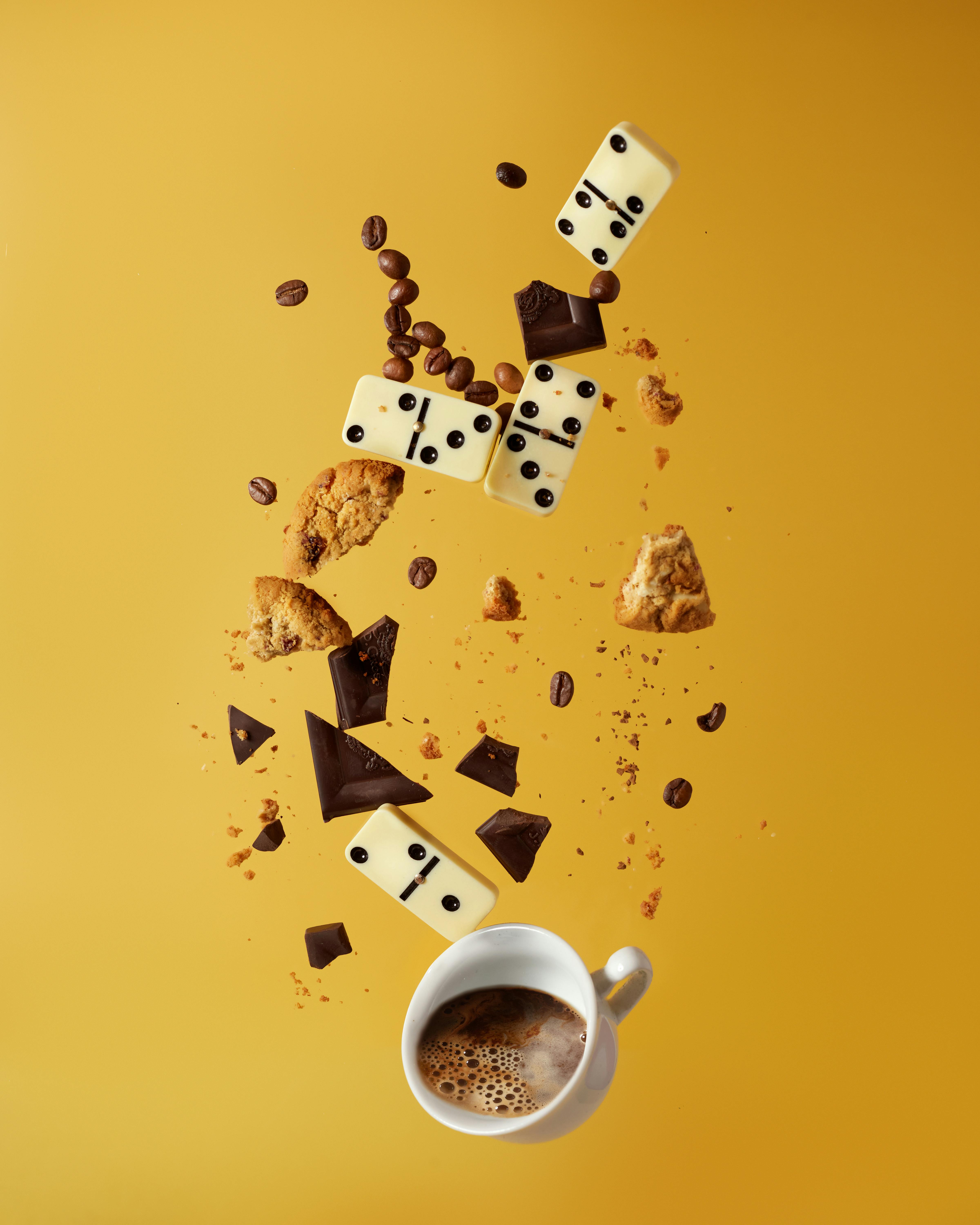 Chocolate Domino Snacks Falling Into Coffee Cup — Food