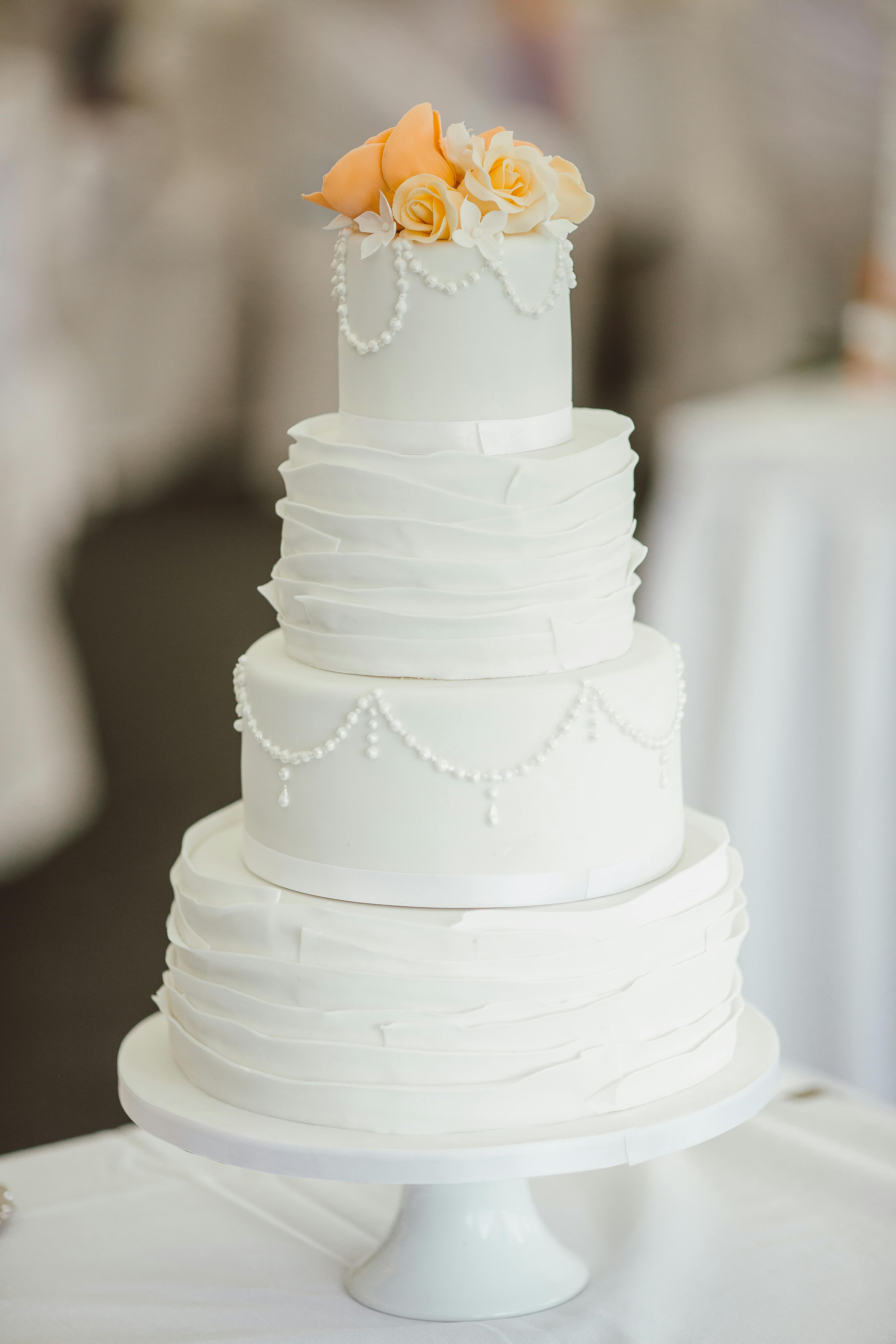 Four-Tiered White Wedding Cake — Food