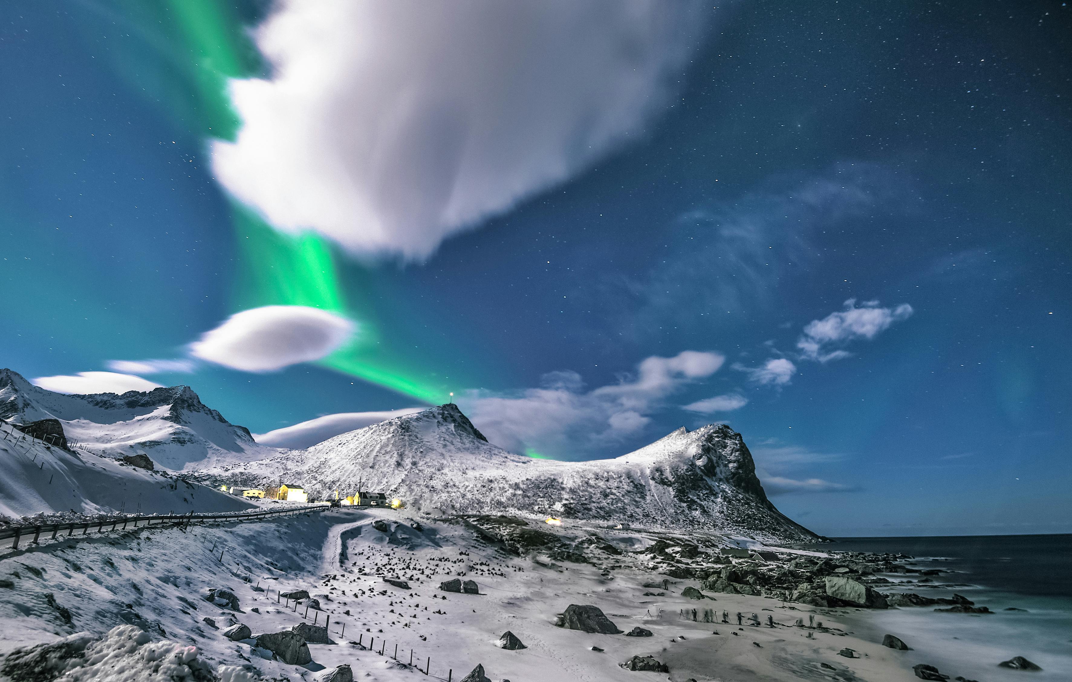 Aurora Over Snowy Coastal Mountains