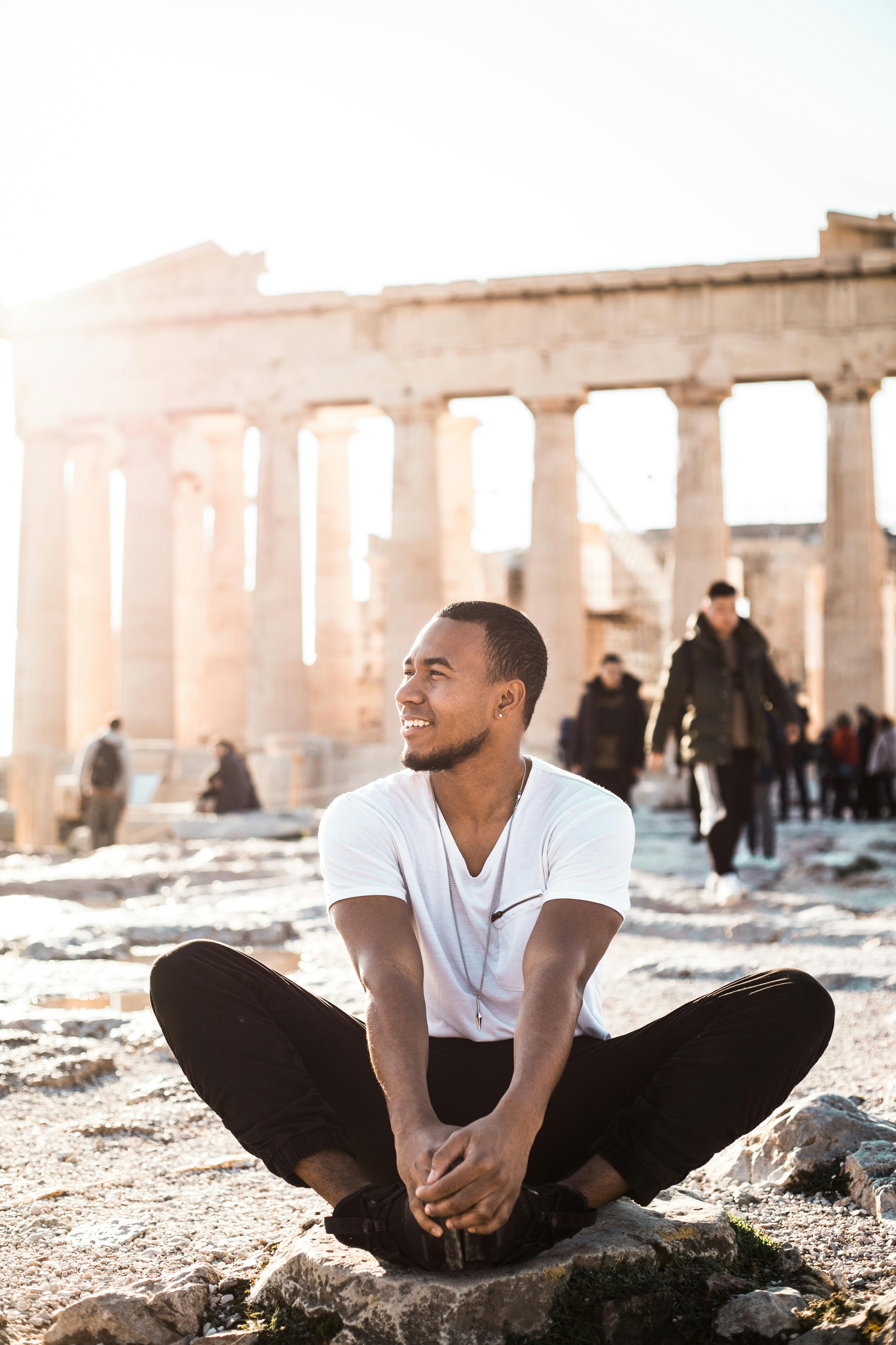 Man Sitting at Parthenon Ruins — People