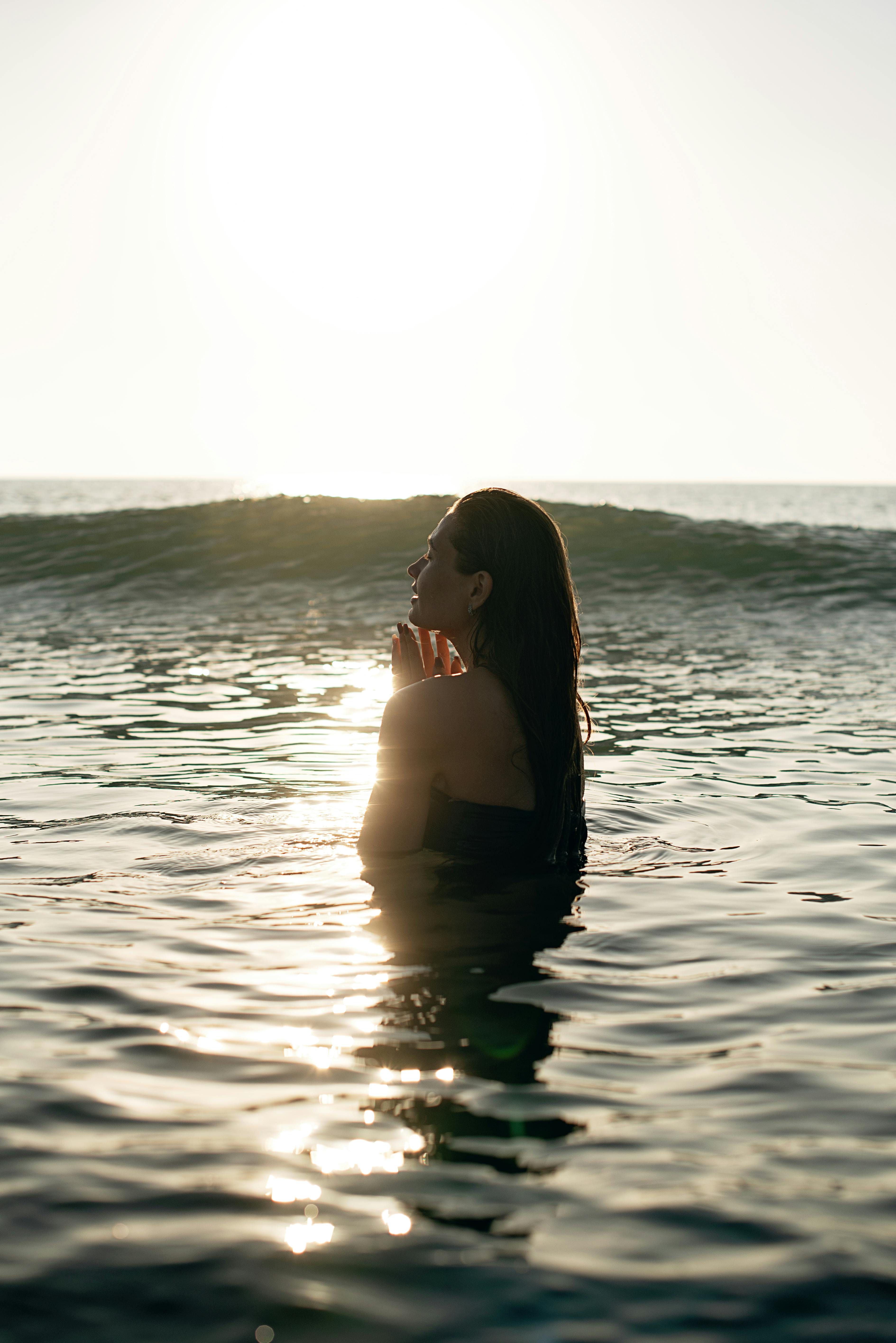 Woman in Ocean at Golden Sunset — Beauty