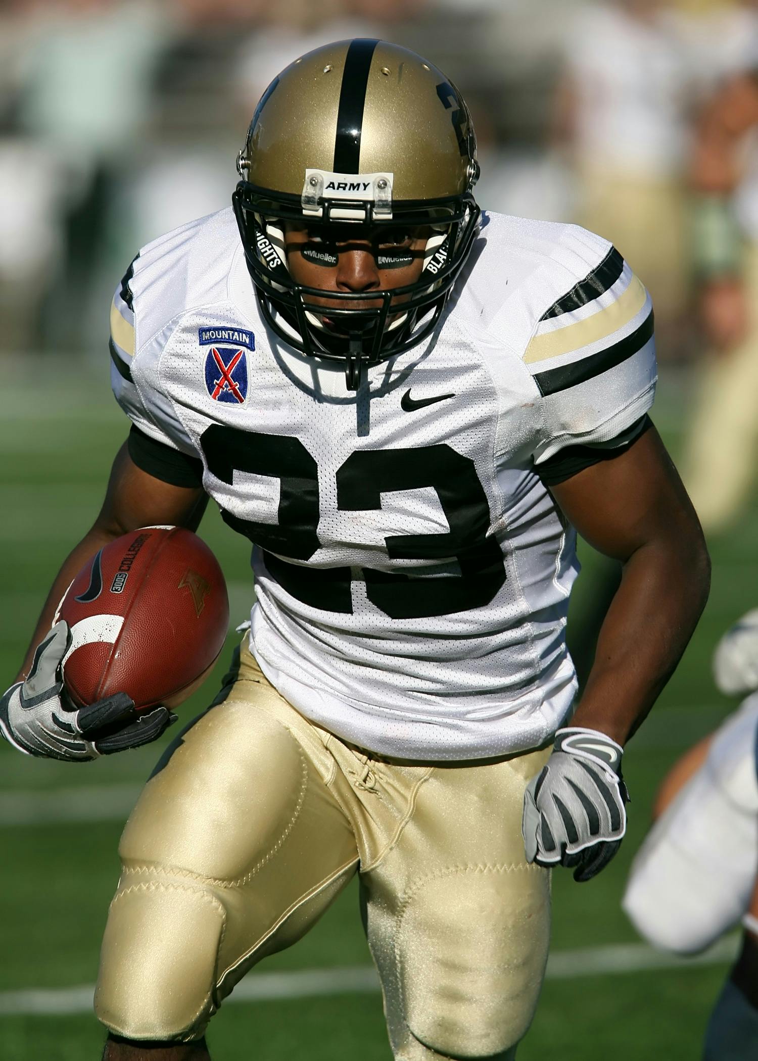 Army Football Player Carrying Football