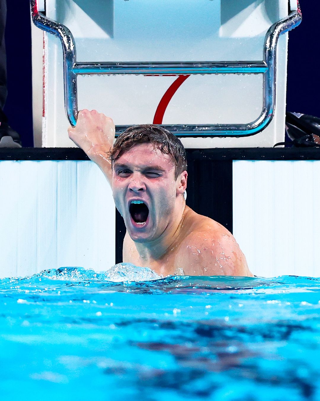 Swimmer Celebrating Victory in Pool