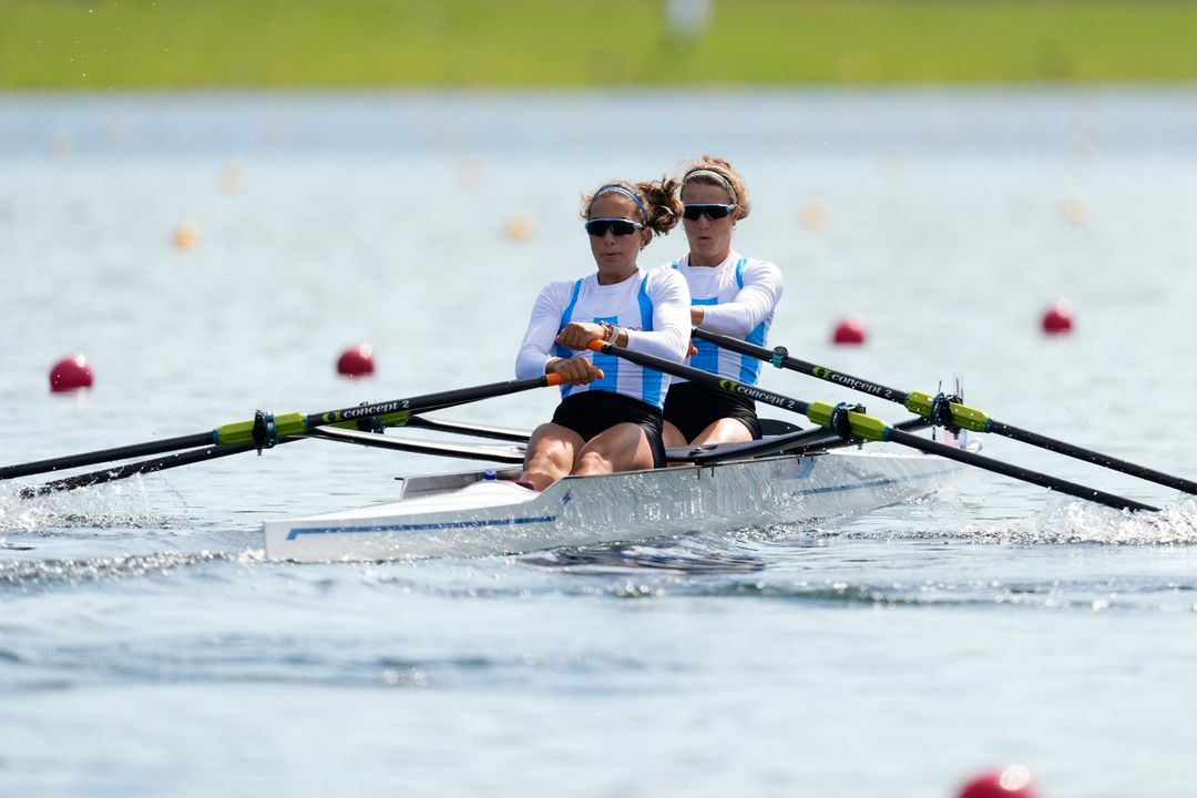 Two Women Competing in Rowing Race
