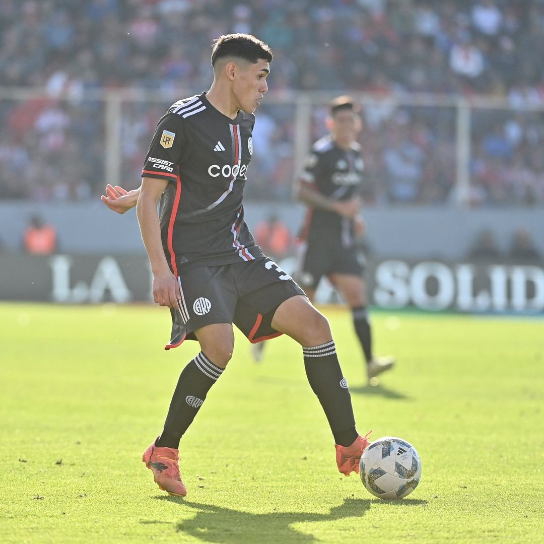 Soccer Player Dribbling During Match