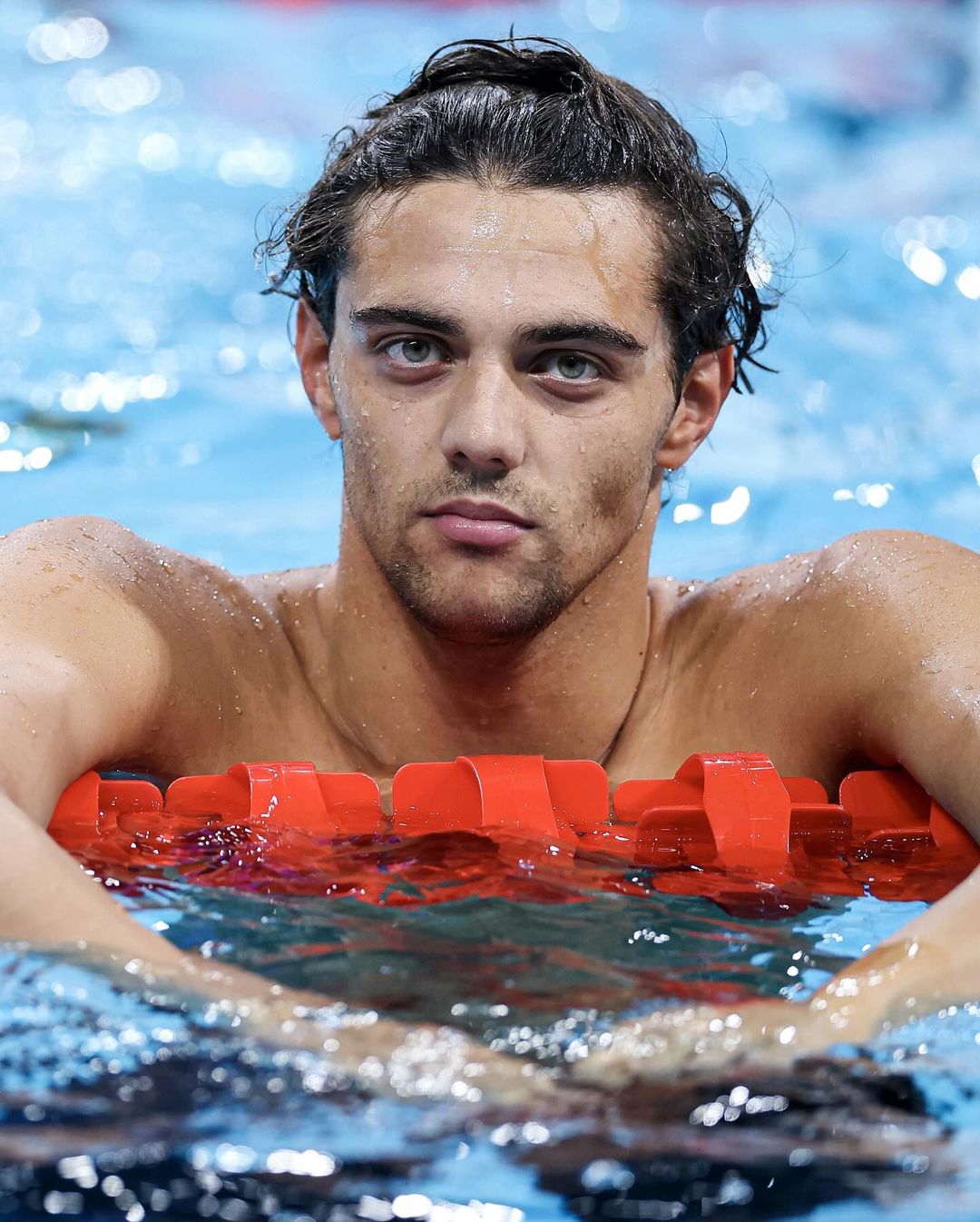 Male Swimmer Resting in Swimming Pool — Sports