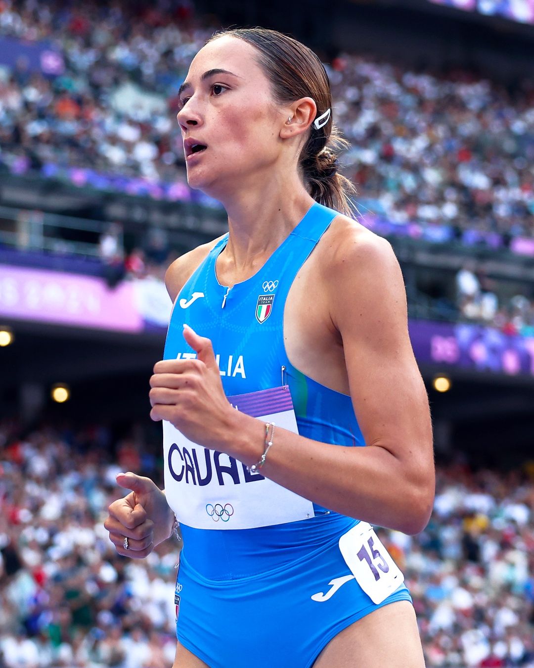 Italian Olympic Runner Mid-Race