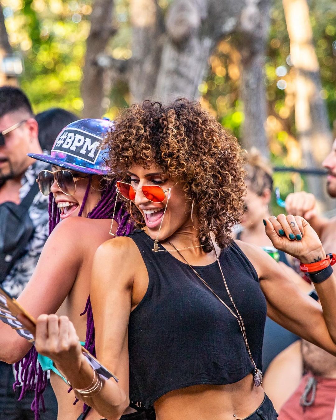 Two Women Dancing at Outdoor Festival