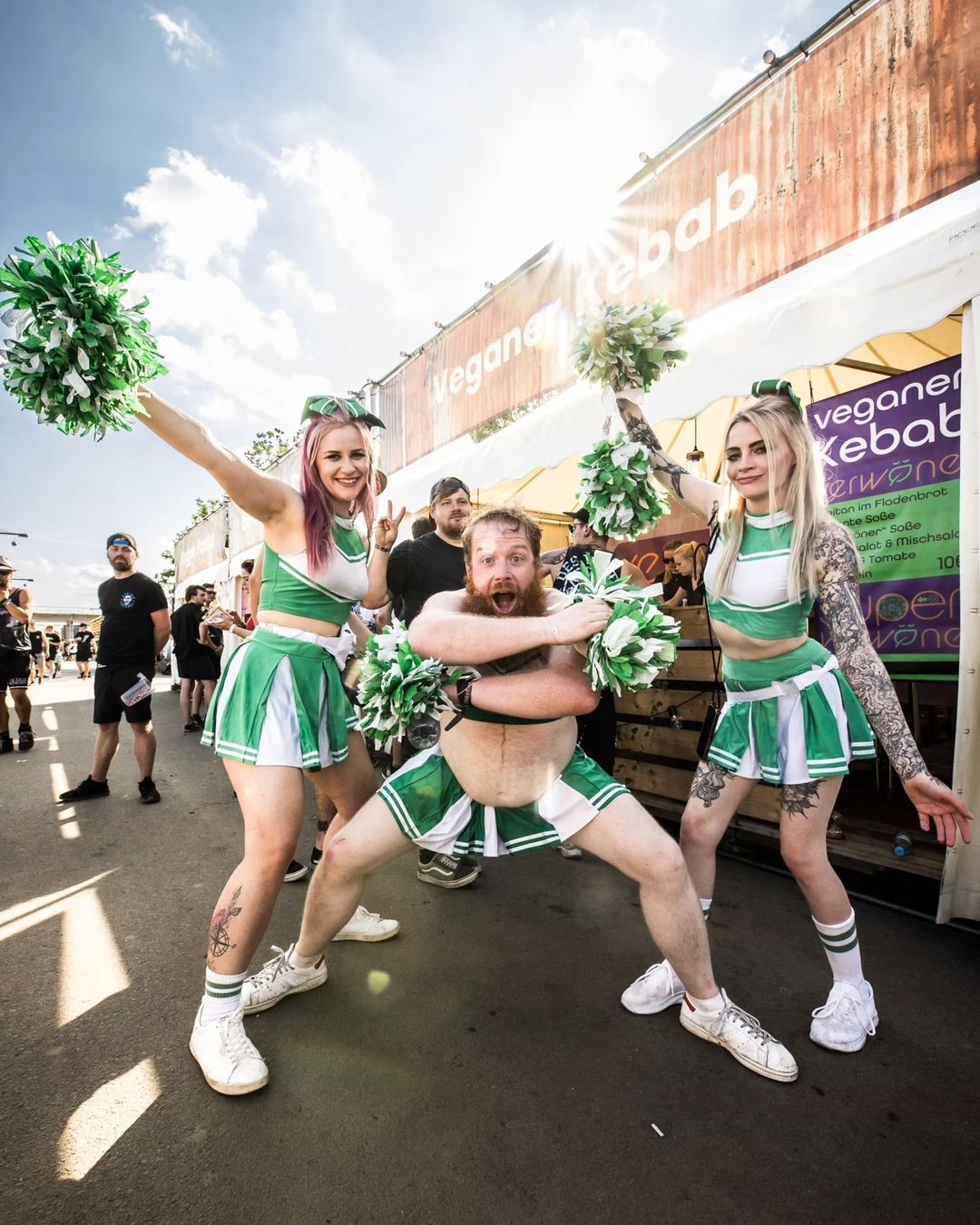 Three Cheerleaders Posing at Food Festival