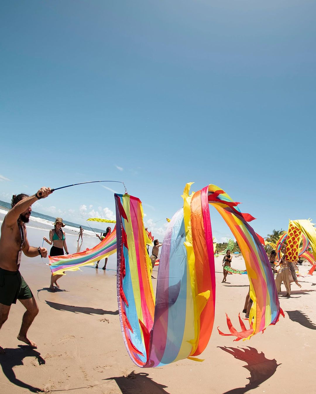 Rainbow Ribbon Dance on Sandy Beach
