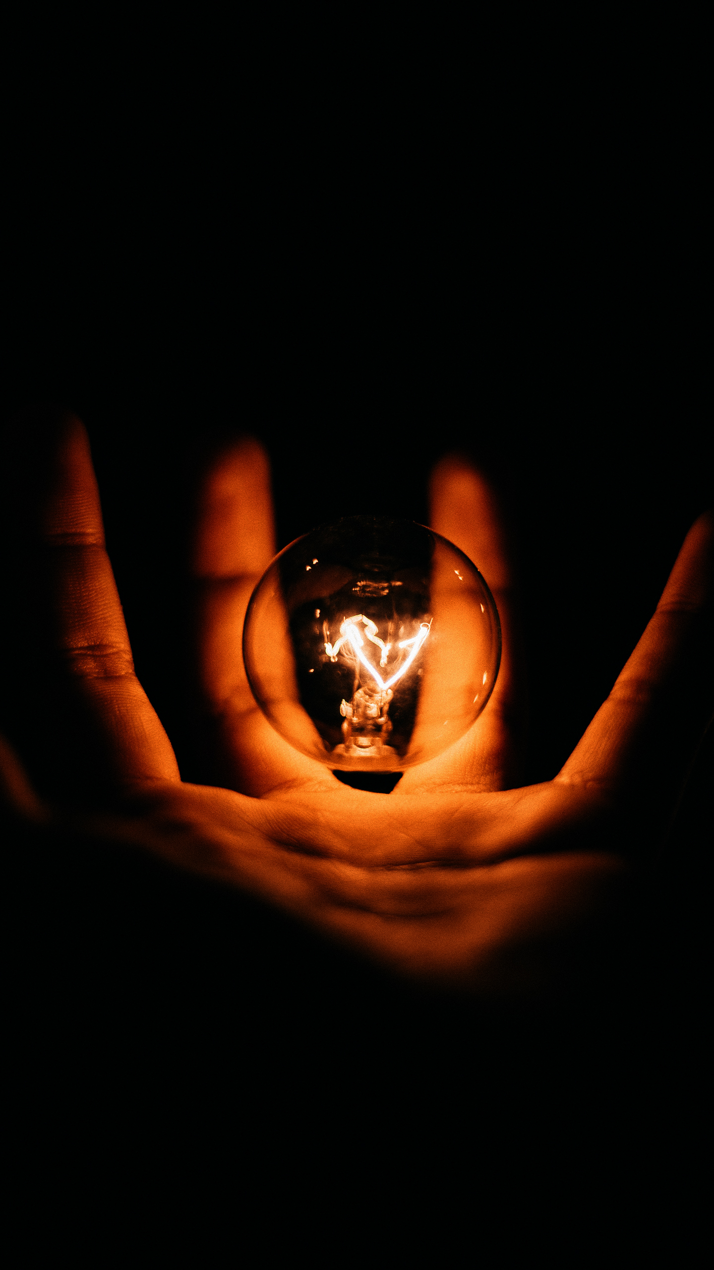 Hand Holding Heart Shaped Lit Bulb — 4K Wallpapers