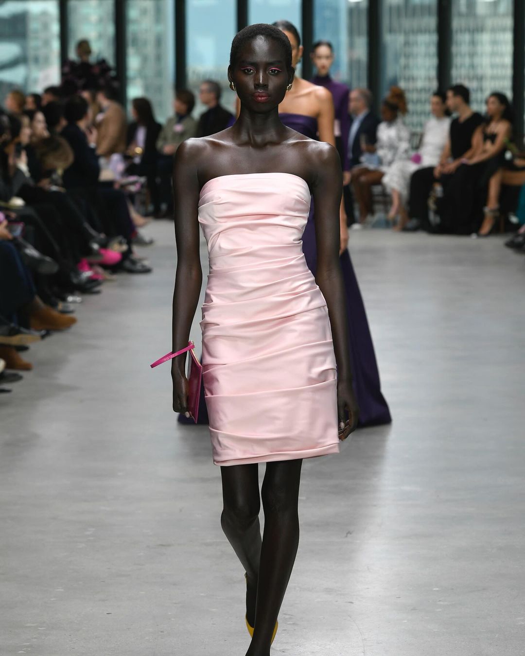 Model in Pink Dress Walks Runway