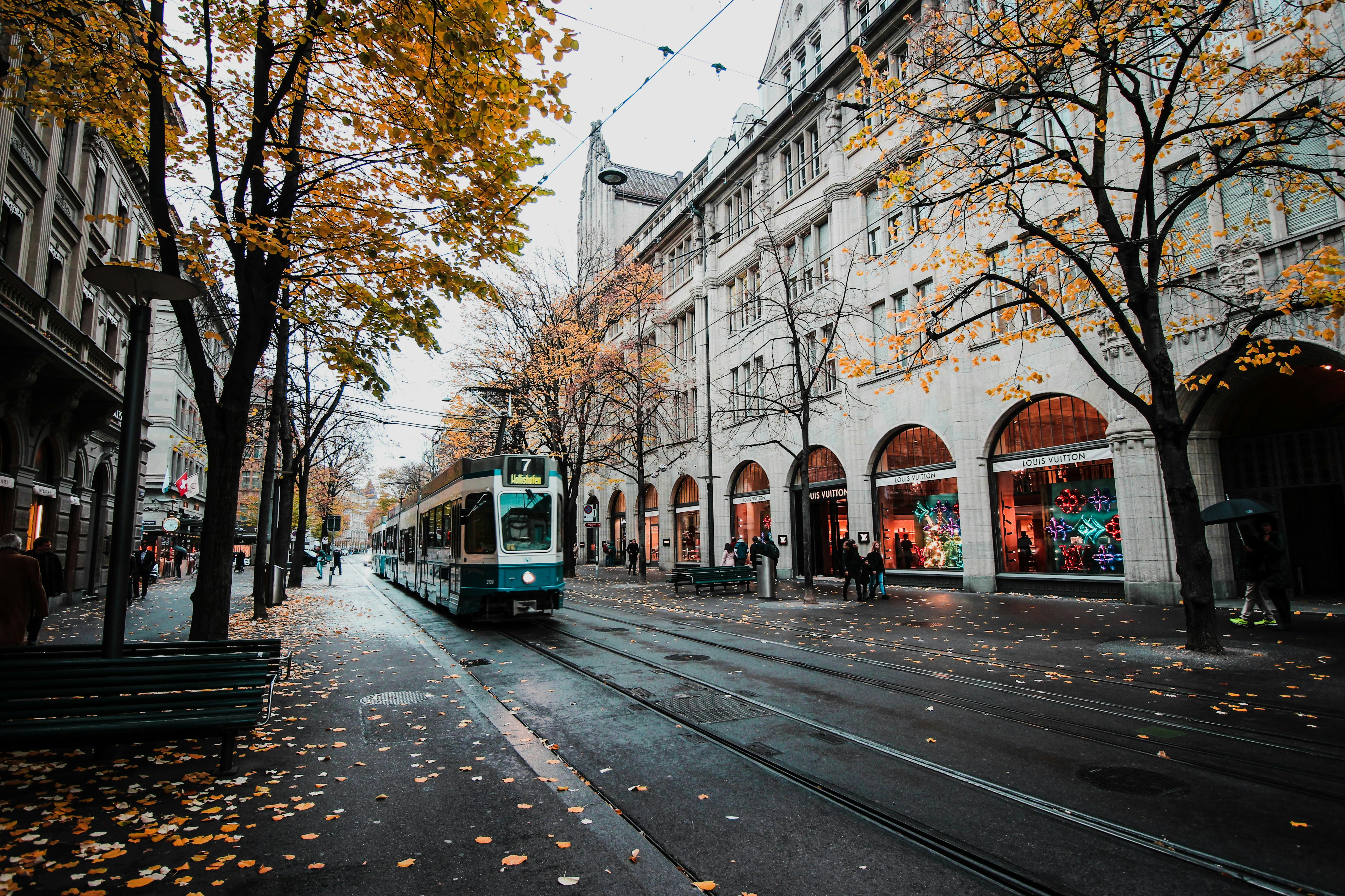 Autumn Shopping Street with City Tram
