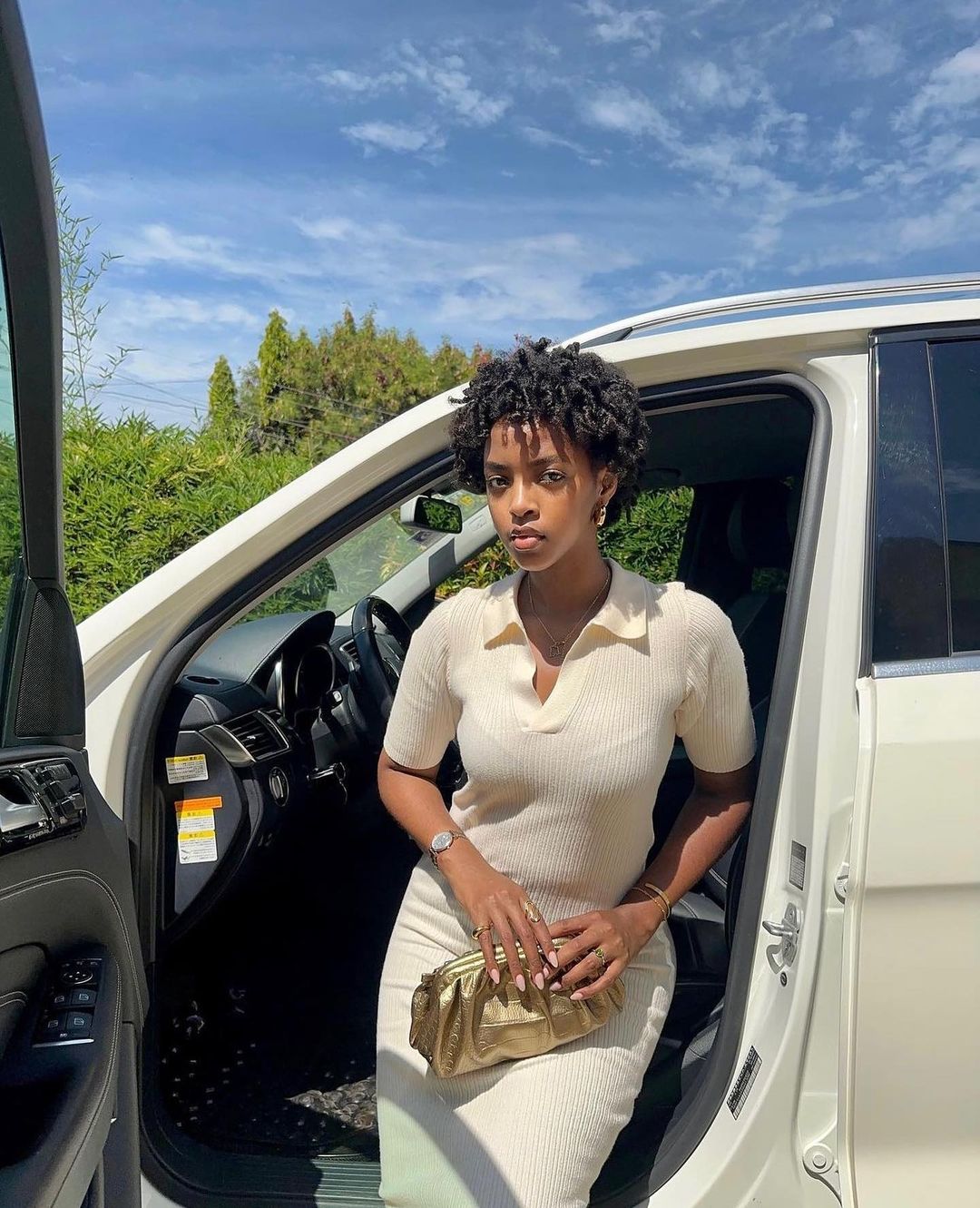 Stylish Woman Exiting White Car