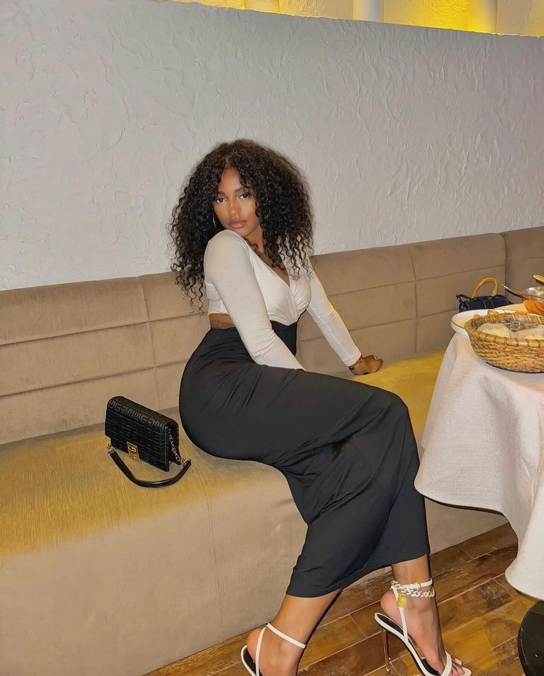 Stylish Woman Posing on Restaurant Booth