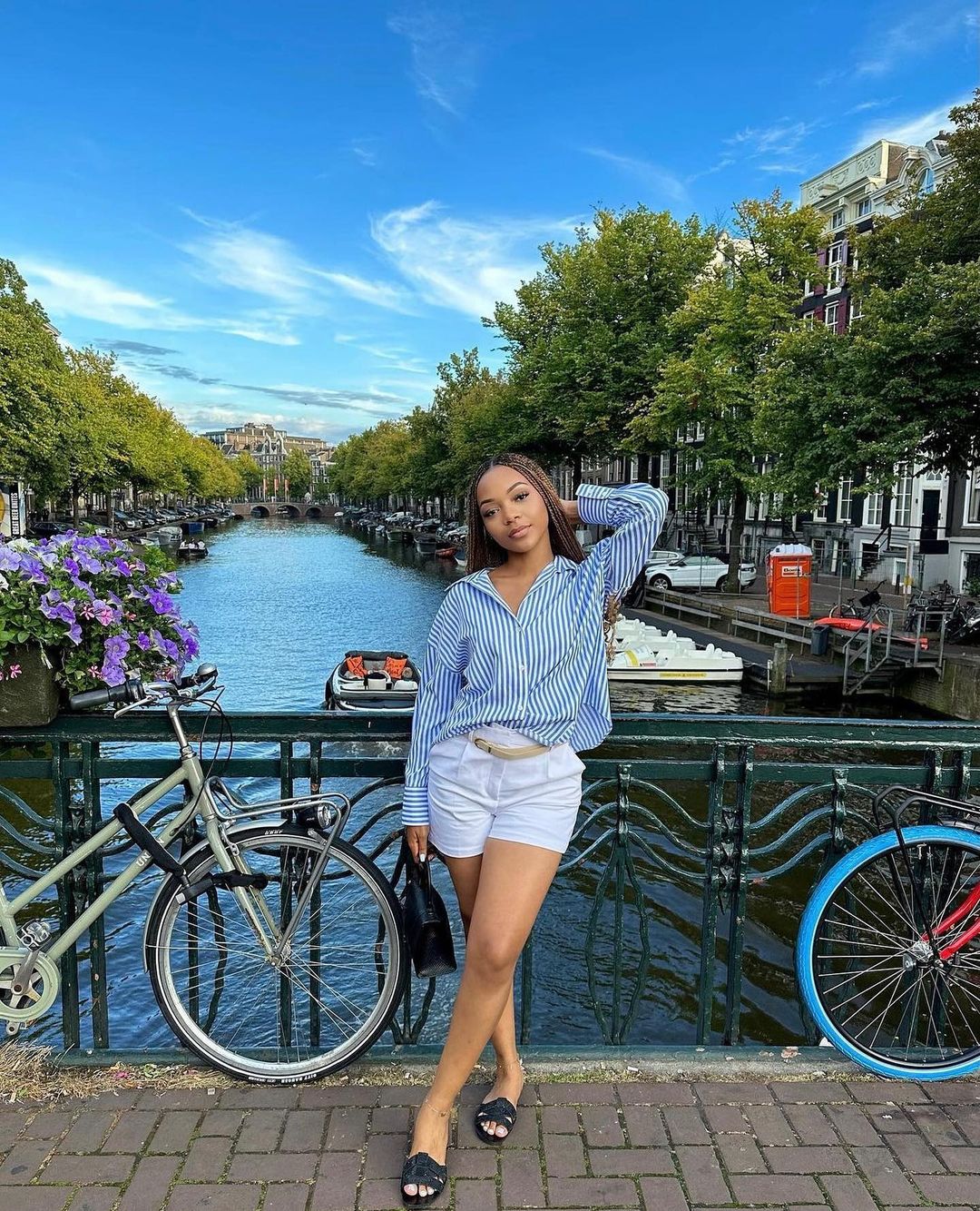 Woman Posing on Amsterdam Canal Bridge