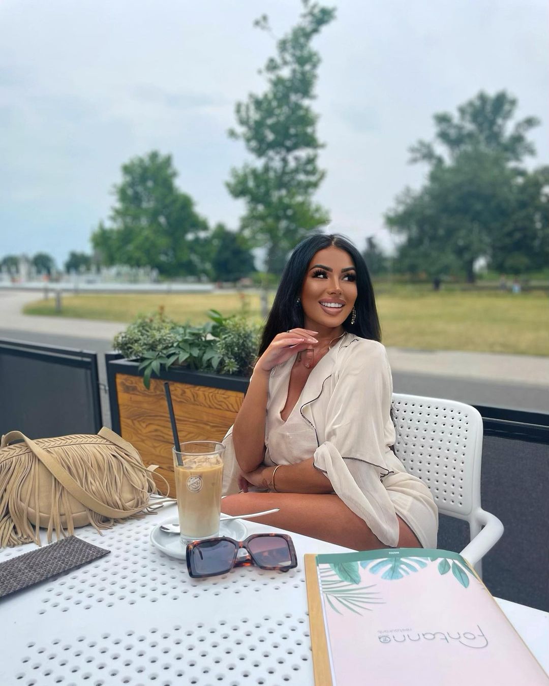 Woman Relaxing At Outdoor Cafe