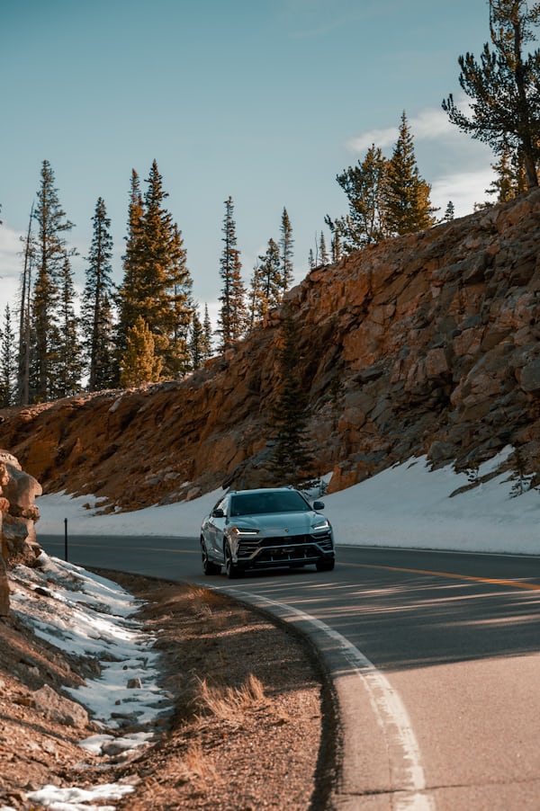 Luxury SUV on Winding Mountain Road