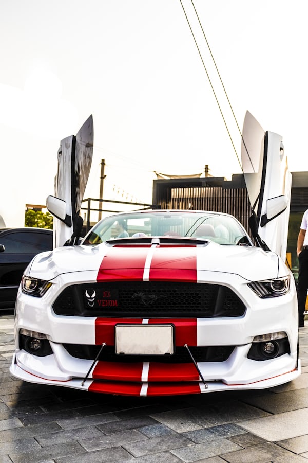 White Mustang with Open Scissor Doors