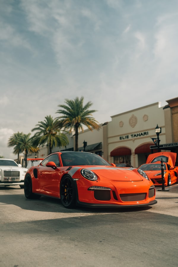 Orange Porsche Sports Car at Shopping Plaza