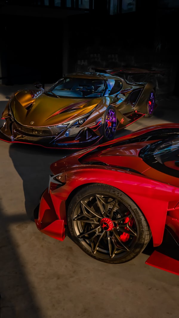 Two Custom Hypercars Parked Indoors