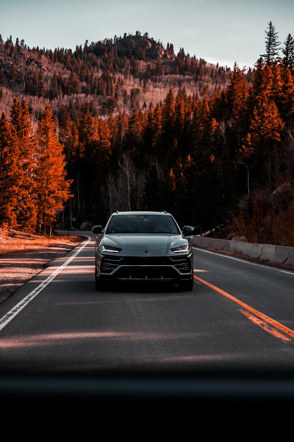 Lamborghini SUV on Scenic Mountain Road