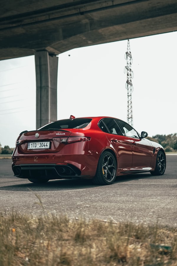 Red Alfa Romeo Giulia Under Overpass