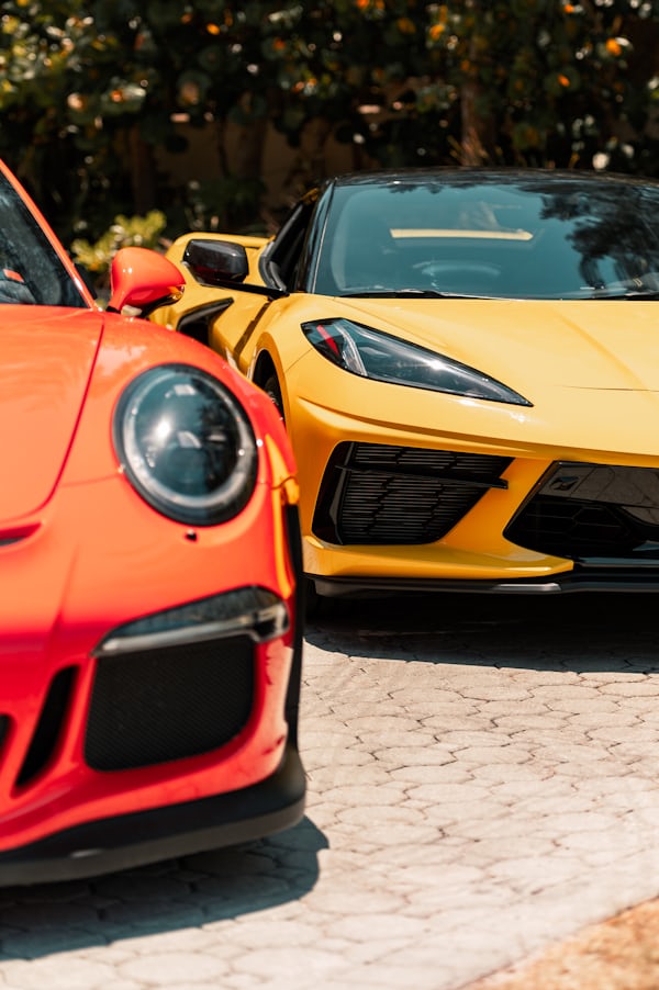 Two Parked Orange and Yellow Sports Cars