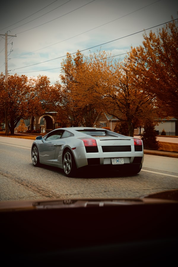 White Supercar on Autumn Residential Street