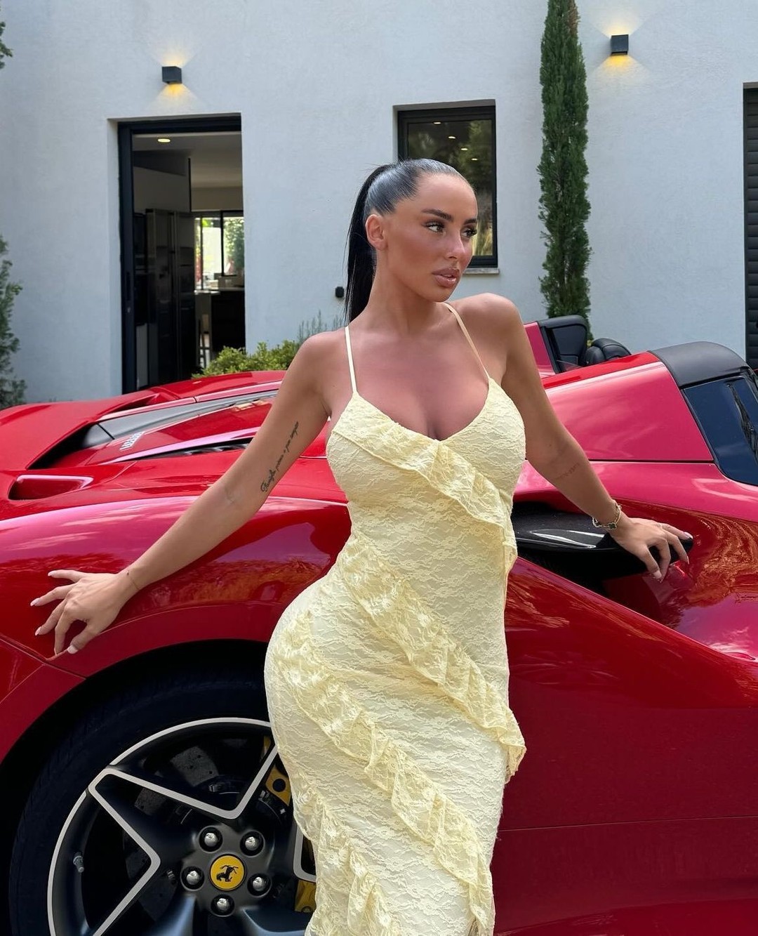 Woman Posing By Red Ferrari