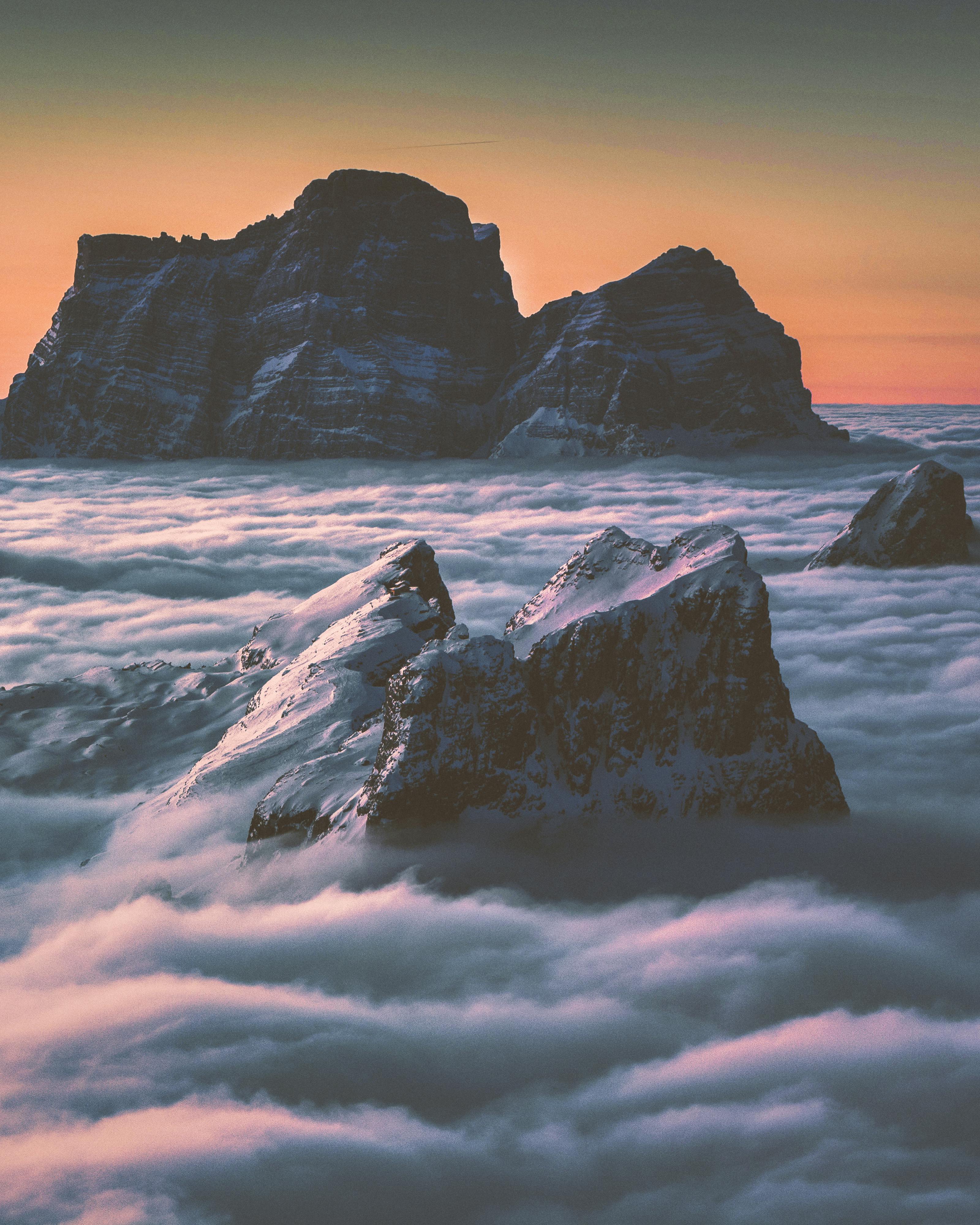 Mountain Peaks Above Cloud Sea at Sunset