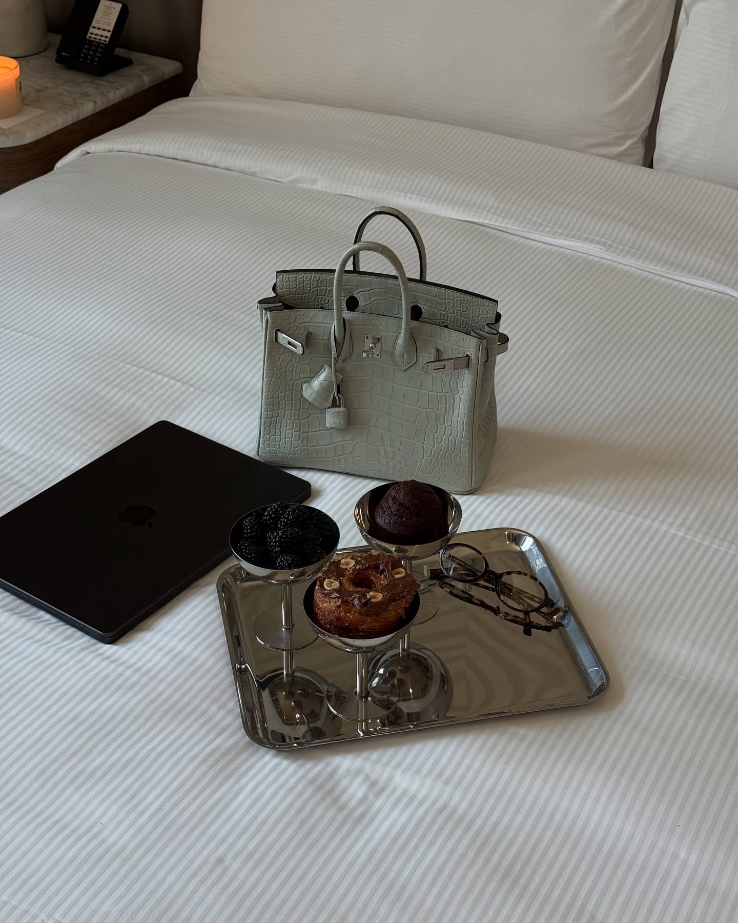Luxury Items on White Hotel Bed