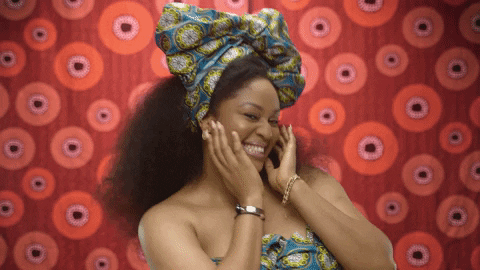 Smiling Woman With Patterned Headwrap