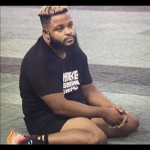 Bearded Man Sitting on Gym Floor