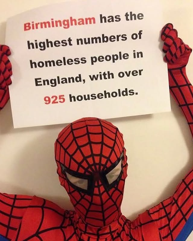 Spider-Man Holds Birmingham Homelessness Sign