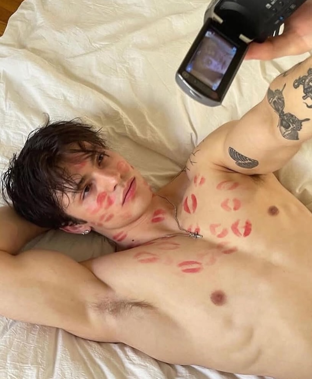 Shirtless Man With Lipstick Marks Taking Selfie