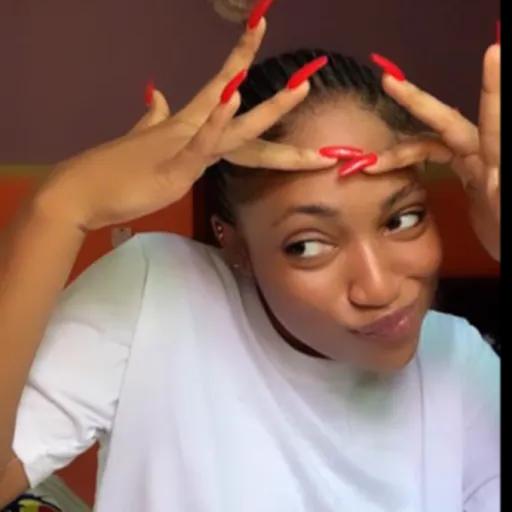 Woman Showing Extra Long Red Nails